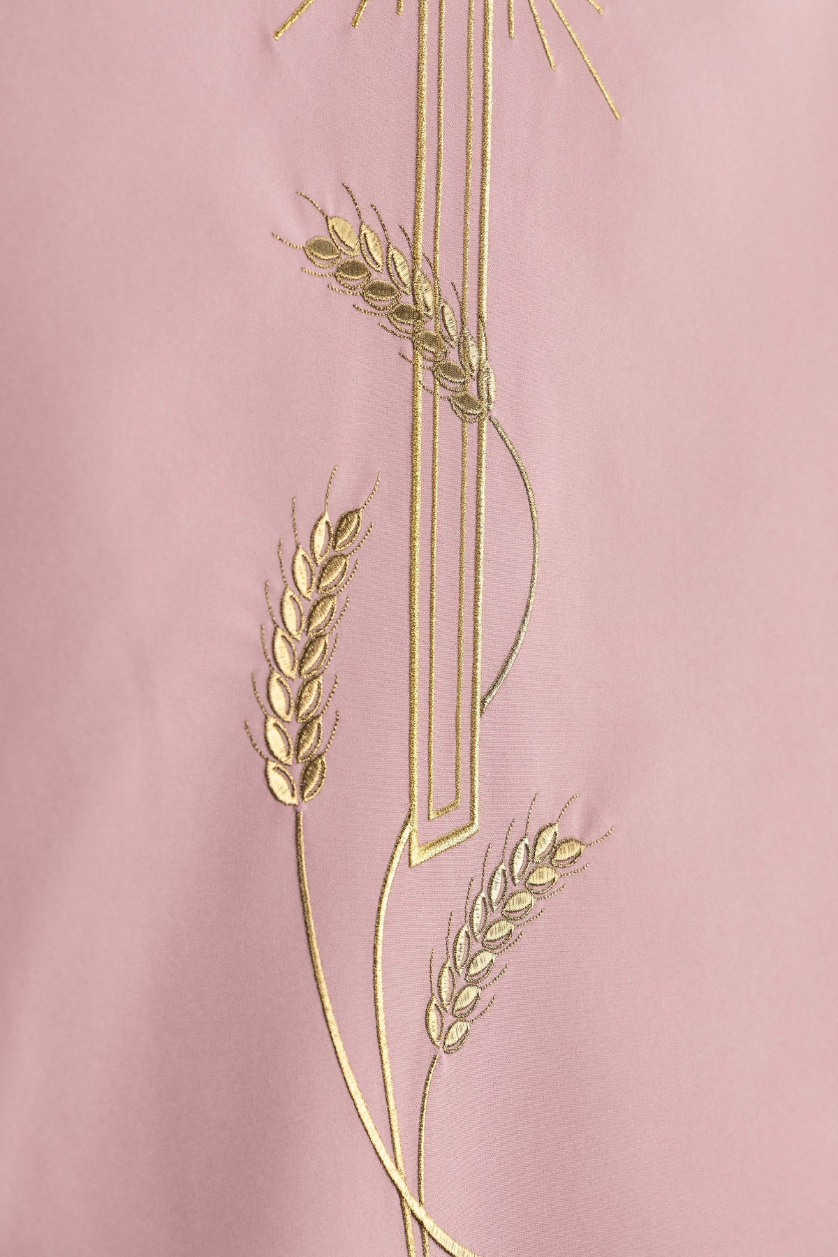 Coprileggio rosa con motivo di croce ricamato
